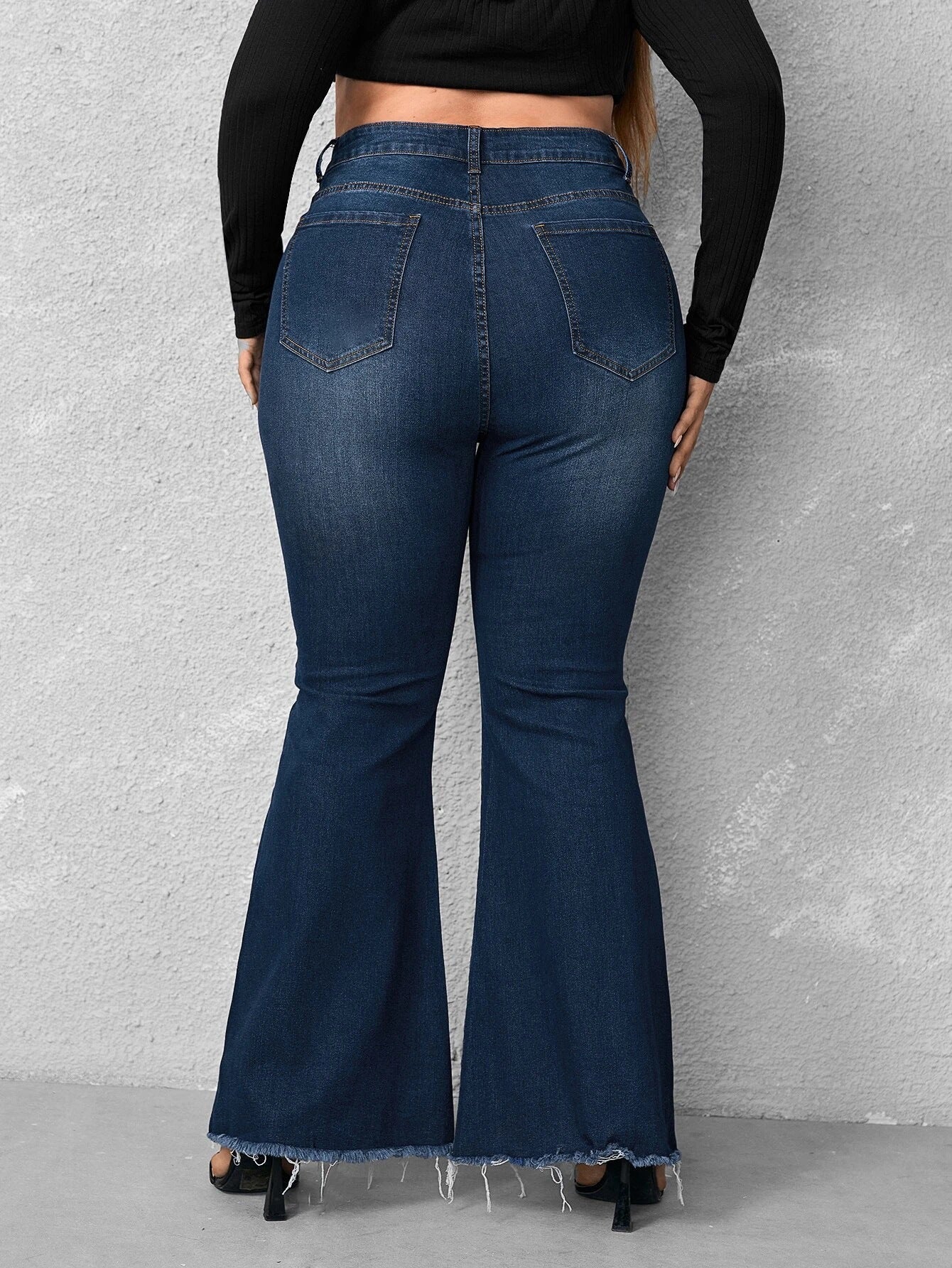 Woochic Pantalon grande taille évasé denim déchiré à bords bruts